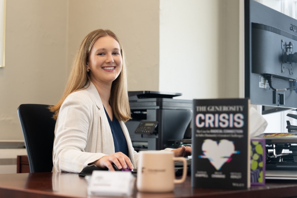 woman smiling at desk