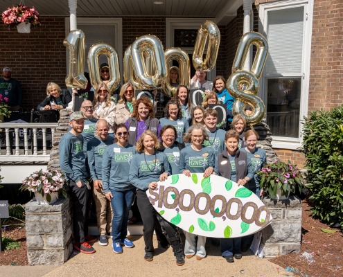 The Great Community Give celebrating their goals.