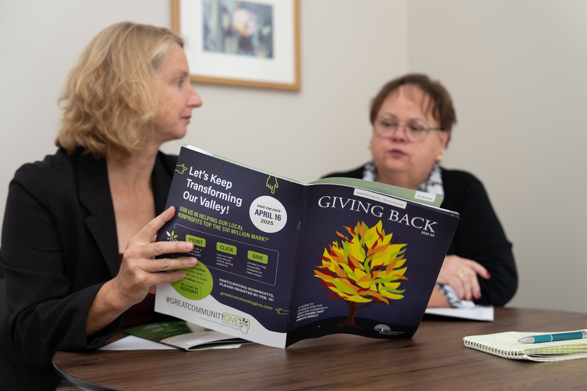 two people reading through the Giving Back Guide